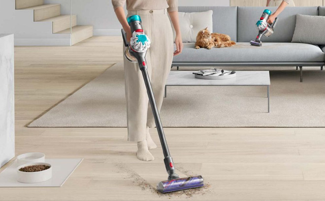 A Person Using Dyson V8 Absolute Cordless Vacuum