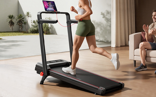 A Woman Running on the RHYTHM FUN Portable Folding Treadmill with Incline