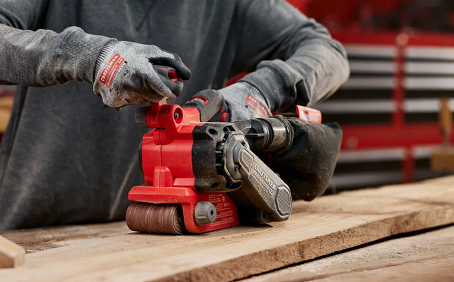 A Woman Using the Craftsman 20 Volt Brushless Variable Speed Belt Cordless Sander A Woman Using the Craftsman 20 Volt Brushless Variable Speed Belt Cordless Sander