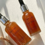 Tan Luxe Face and Body Illuminating Self Tan Drops on the Table