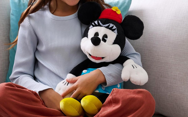 A Kid Holding Gund Disney Minnie Mouse Plush Toy