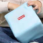 A Kid Holding a Fisher Price Toddler Soft Foam Building Block
