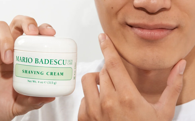 A Man Holding Mario Badescu Shaving Cream