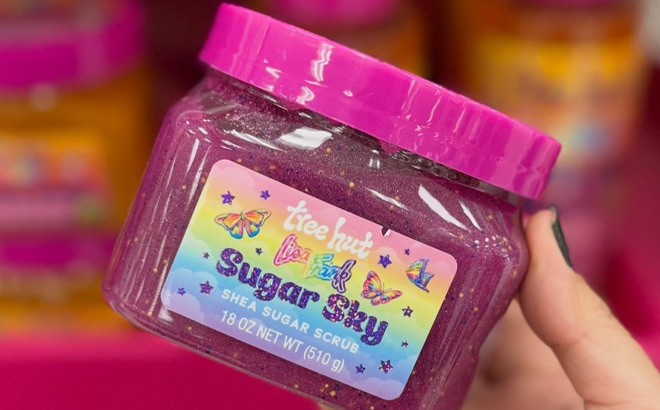 A Person Holding a Pink Tub of Sucar Scrub