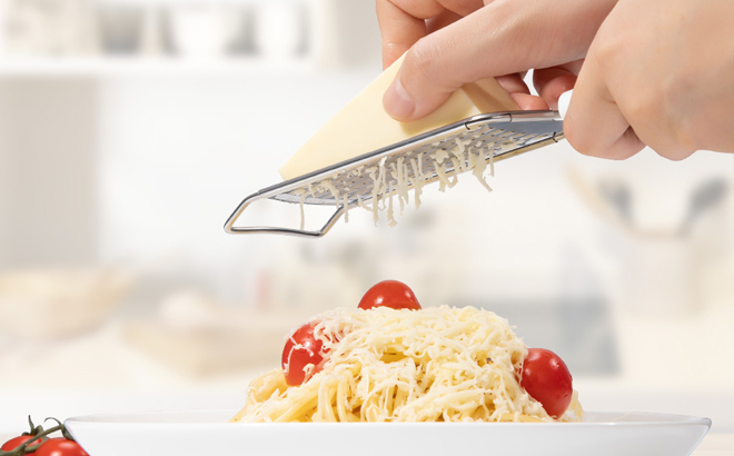 A Person Using the Rainspire Professional Cheese Grater