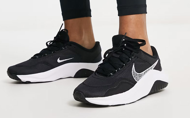 A Person Wearing Nike Legend Essential 3 Next Nature Womens Workout Shoes
