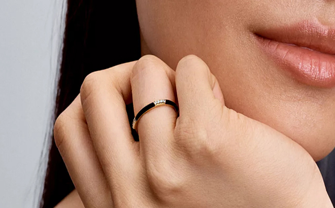 A Woman Wearing Pandora Black Enamel and Stones Statement Ring