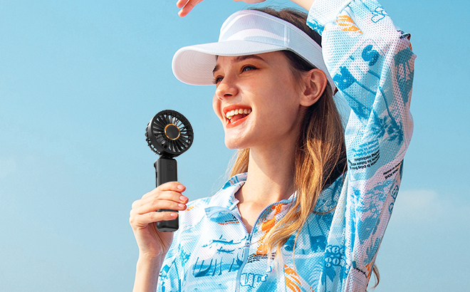 Person Holding Rechargable Handheld Fan