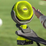 Ryobi ONE 18V Cordless 4 Inch Clamp Fan on a Beach Chair