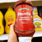 A Person Holding Hunts Tomato Ketchup