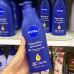 A Person Holding Nivea Essentially Enriched Body Lotion