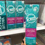 A Person Holding Toms Of Maine Toothpaste