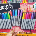 A Person Holding a Sharpie Pack inside a Store