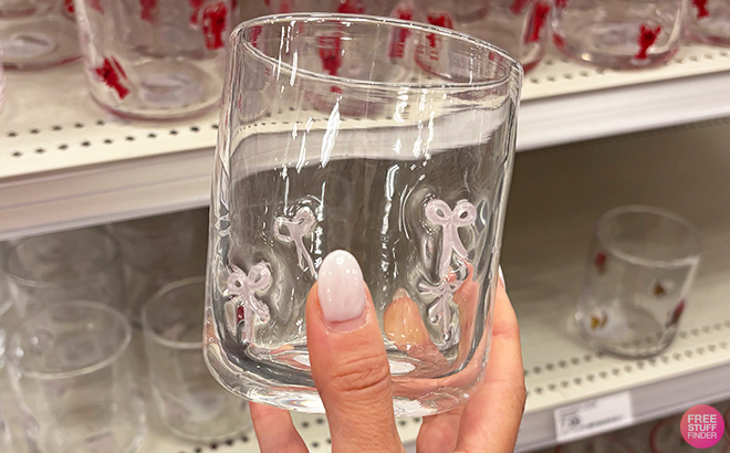 A Person Holding the Madison Home 16 fl oz Icon Glass Bows Glass at Target