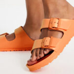 A Person Wearing Birkenstock Arizona Essentials EVA Slide Sandals