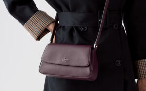 A Person Wearing Kate Spade Outlet Sutton Mini Crossbody Bag