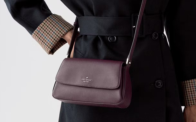 A Person Wearing Kate Spade Outlet Sutton Mini Crossbody Bag A Person Wearing Kate Spade Outlet Sutton Mini Crossbody Bag