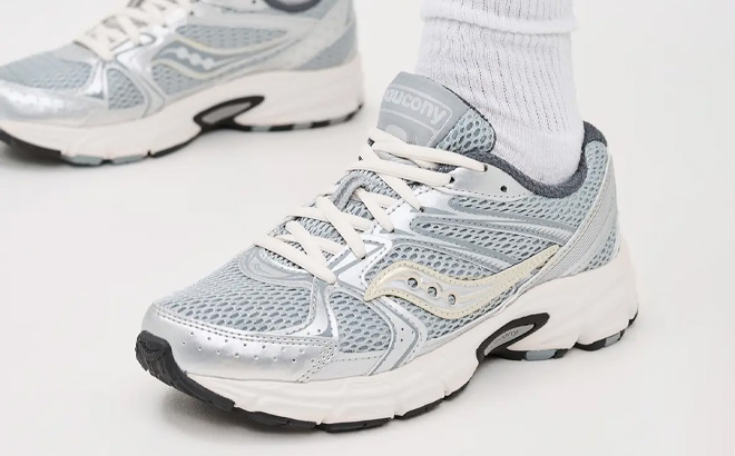 A Person Wearing Saucony Womens Ride Millennium Athletic Shoes