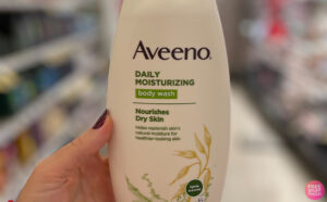 A Peson Holding the Aveeno Moisturizing Daily Body Wash at a Store