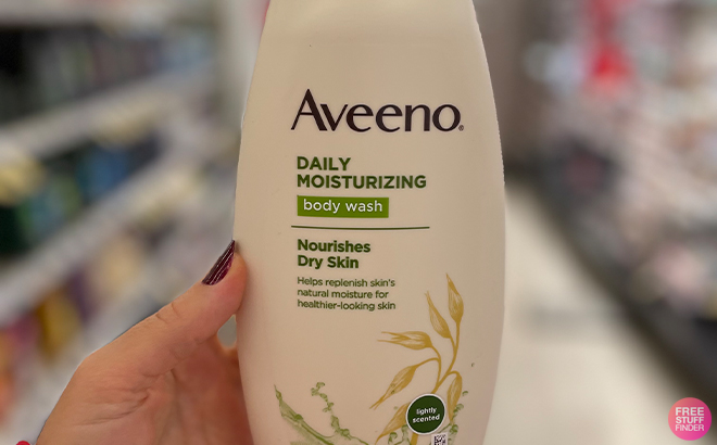 A Peson Holding the Aveeno Moisturizing Daily Body Wash at a Store