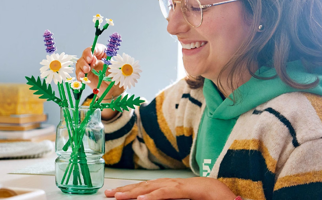 A Woman Arranging the LEGO Botanicals Daisies Flower Set A Woman Arranging the LEGO Botanicals Daisies Flower Set
