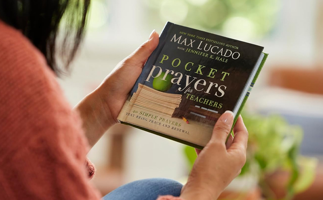 A Woman Holding Pocket Prayers for Teachers Book A Woman Holding Pocket Prayers for Teachers Book