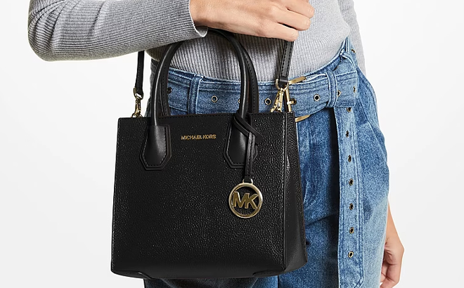 A Woman Wearing Michael Kors Mercer Medium Pebbled Leather Crossbody Bag