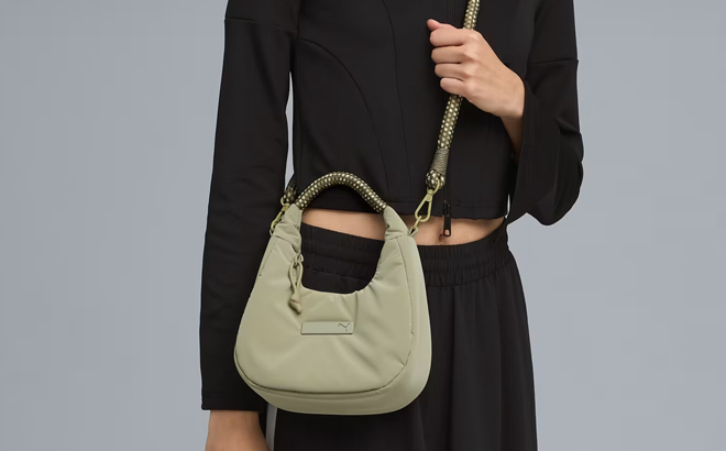 A Woman Wearing Puma Beyond Labels Mini Bag A Woman Wearing Puma Beyond Labels Mini Bag
