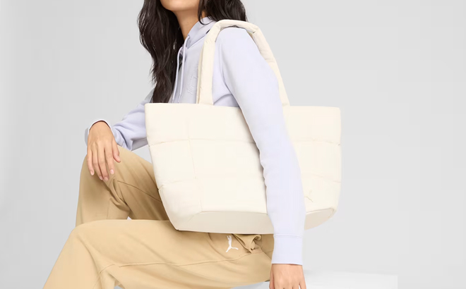A Woman Wearing Puma Tote Bag A Woman Wearing Puma Tote Bag