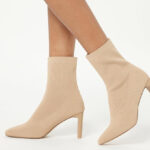 A Woman Wearing The Drop Womens Jane High Heel Pull on Sock Boots