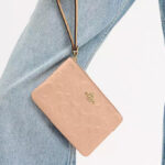 Coach Outlet Corner Zip Wristlet In Signature Canvas in Pink Color