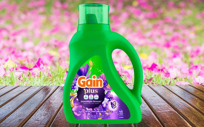 Gain Moonlight Breeze Plus Liquid Laundry Detergent on the Table