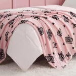 Juicy Couture Plush Throw on the Bed