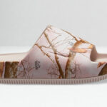 Nike Calm Real Tree Womens Slide Sandal on the Table