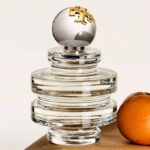 Tory Burch Sublime Eau de Parfum on a Product Stand