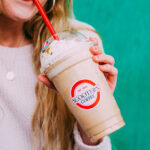 a Peson Drinking Scooters Iced Caramelicious Drink