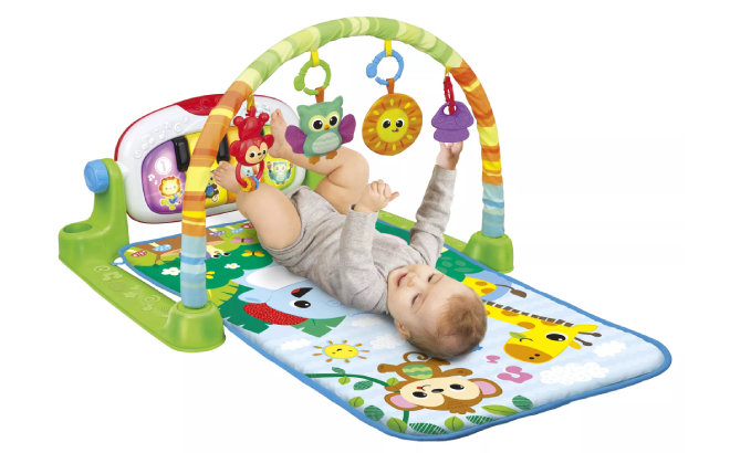 A Baby Playing with Winfun Jungle Pals Kick n Play Musical Gym A Baby Playing with Winfun Jungle Pals Kick n Play Musical Gym