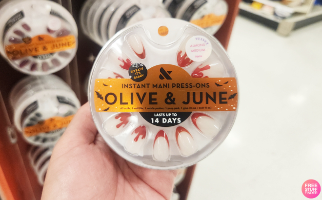 A Person Holding Olive June Vampire Velvet French Press On Fake Nails