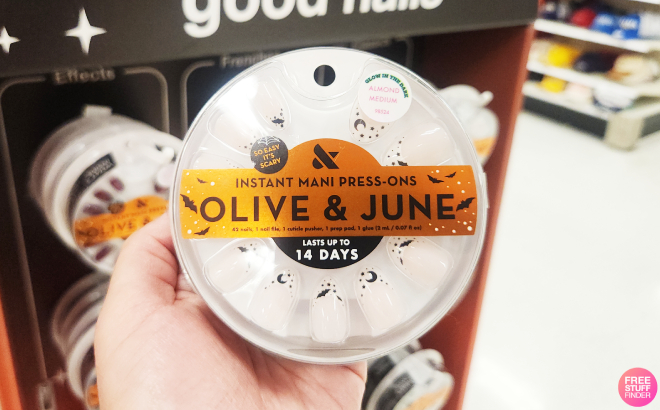 A Person Holding Olive June Witching Hour French Press On Fake Nails