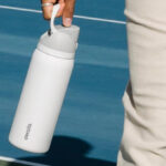 A Person Holding Owala FreeSip Stainless Steel 32 oz Water Bottle
