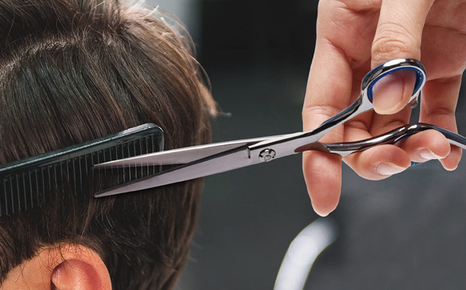 A Person Using the ULG Professional Hair Cutting Scissors