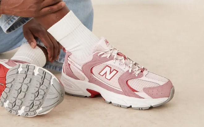 A Person Wearing New Balance 530 Shoes A Person Wearing New Balance 530 Shoes