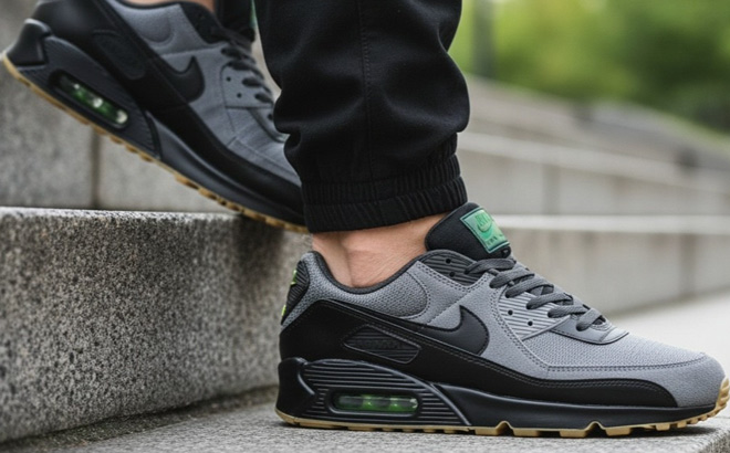 A Person Wearing Nike Mens Air Max 90 Casual Shoes A Person Wearing Nike Mens Air Max 90 Casual Shoes