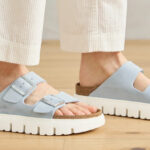 A Person Wearing Papillio by Birkenstock Arizona Platform Womens Slide Sandals in Baby Blue