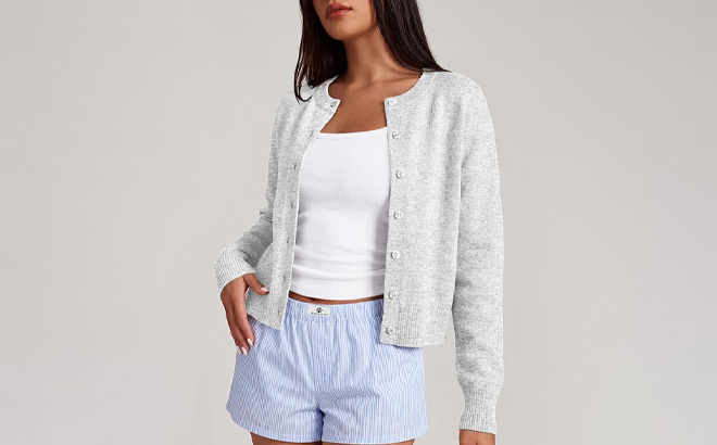 A Person Wearing Trendy Queen Cropped Cardigan Sweater A Person Wearing Trendy Queen Cropped Cardigan Sweater