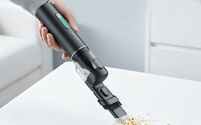 A Woman Cleaning with the Dreame 4 in 1 Hand Vacuum A Woman Cleaning with the Dreame 4 in 1 Hand Vacuum