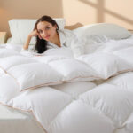 A Woman Laying on the Vexino Feather Down Fiber Comforter