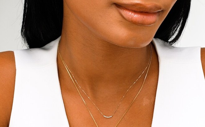 A Woman Weaing Zales Lab Grown Diamond Accent Curved Necklace in 10K Gold