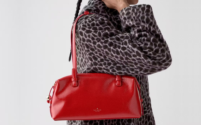 A Woman Wearing Kate Spade Billie Shiny Leather Shoulder Bag A Woman Wearing Kate Spade Billie Shiny Leather Shoulder Bag