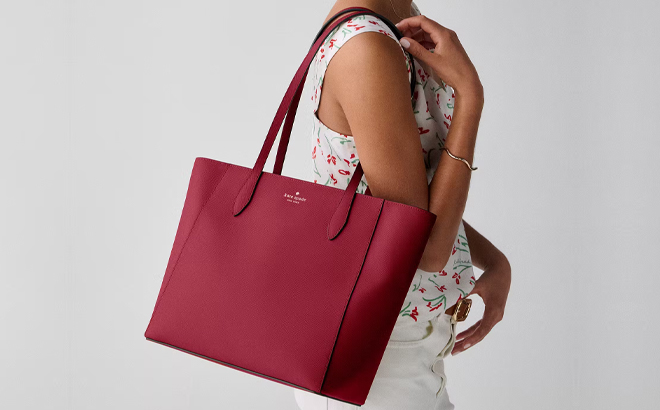 A Woman Wearing Kate Spade Dana Tote Bag in Red Jam A Woman Wearing Kate Spade Dana Tote Bag in Red Jam